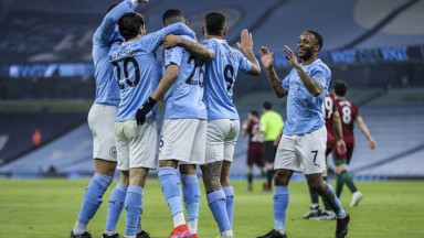 Man City players celebrating after scoring
